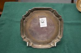 A small silver waiter.