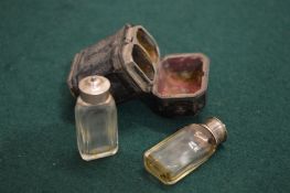 An 18th / 19th century pair of miniature perfume bottles in leather case.