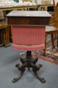 A 19th century rosewood pedestal sewing table, possibly Isle of Man, on carved cabriole legs with