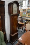 An 18th century mahogany longcase clock with eight day movement, the silvered arch dial signed Sam