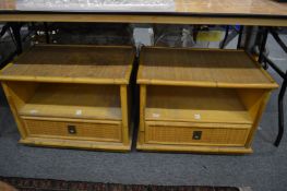 A pair of bamboo and rattan single drawer bedside or lamp tables.