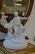 A Parian ware style group of two children.