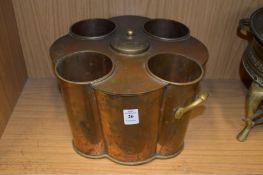 A copper and brass four bottle wine cooler.