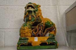 A large Sancai glazed Chinese pottery model of a lion.