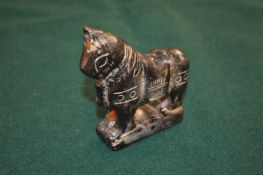 A Chinese carved hardstone figure of a horse.