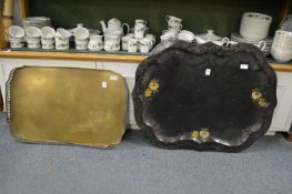 A Tole ware tray and a brass galleried tray.