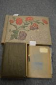 Two photograph albums and a scrap book all containing numerous photographs, postcards etc.