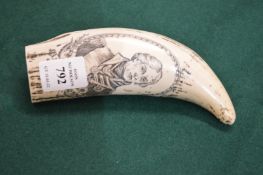 A reproduction scrimshaw tooth.