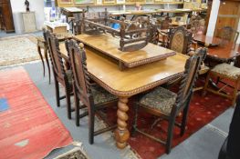 A set of six oak high back chairs with barley twist columns and legs.