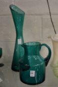 A Holmegaard kingfisher blue carafe / vase together with a similar large jug.