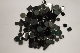 A box of unmounted onyx and bloodstone.