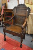 An 18th century design carved oak Wainscot armchair.