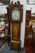 An 18th century oak and mahogany longcase clock with eight day movement, the painted arch dial