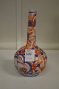 A small Imari decorated bottle vase.