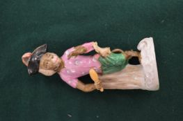 A small continental figure of a monkey musician.