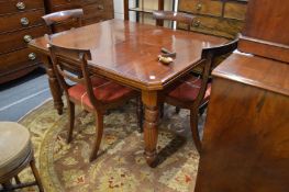 A walnut extending dining table (no leaves).