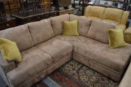 A modern suede upholstered corner lounge suite.