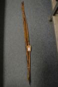 An African bow and small collection of steel tipped arrows.