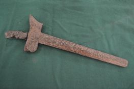 A Malaysian Kris with well carved handle and scabbard.