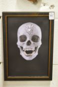 In the manner of Damien Hirst, The Crystal Skull, a photographic print on canvas, framed.