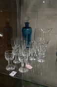 A Holmegaard Kluk Kluk decanter and stopper together with twelve Holmegaard schnapps glasses and a