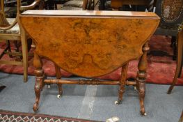 A Victorian figured walnut Sutherland table.