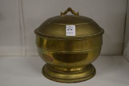 A Chinese brass pedestal bowl and cover.