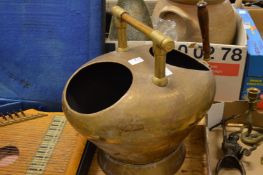 An unusual brass coal box.