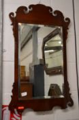 A mahogany fretwork framed wall mirror.