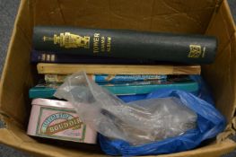 A box containing various albums and loose stamps.