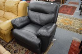 A black leather upholstered reclining armchair.