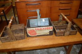 A pair of wooden bottle carriers and similar items.