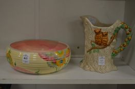 Clarice Cliff, a floral decorated circular bulb bowl, together with a Clarice Cliff jug moulded as a
