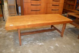 A teak rectangular coffee table.