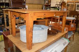 A pine kitchen table.