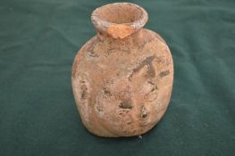 An old moulded terracotta vessel.