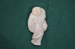 A Chinese carved hardstone figure.