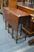 A mahogany drop leaf spider leg table.