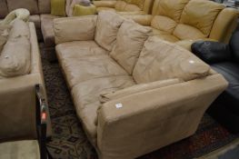 A tan leather upholstered three seater settee.