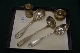 A silver sauce ladle, two other silver spoons and a mustard pot and pepperette.