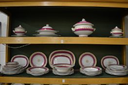 A comprehensive late 19th century dinner service decorated with pink and gilt borders to include