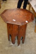 An eastern octagonal hardwood table and inlaid stand.