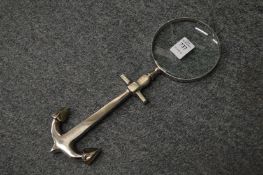 A magnifying glass with anchor handle.