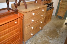 An oak chest of drawers.
