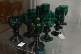 A group of 19th century and later green glass goblets.