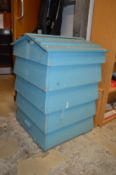 A blue painted beehive.