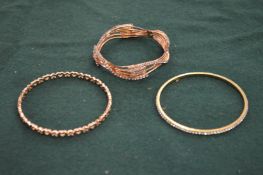 Three bangles.