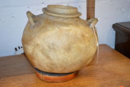 An unusual eastern table lamp made from a camel's bladder.