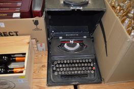 An old typewriter and petrol can.