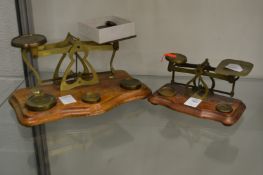 Two postal scales with various weights.